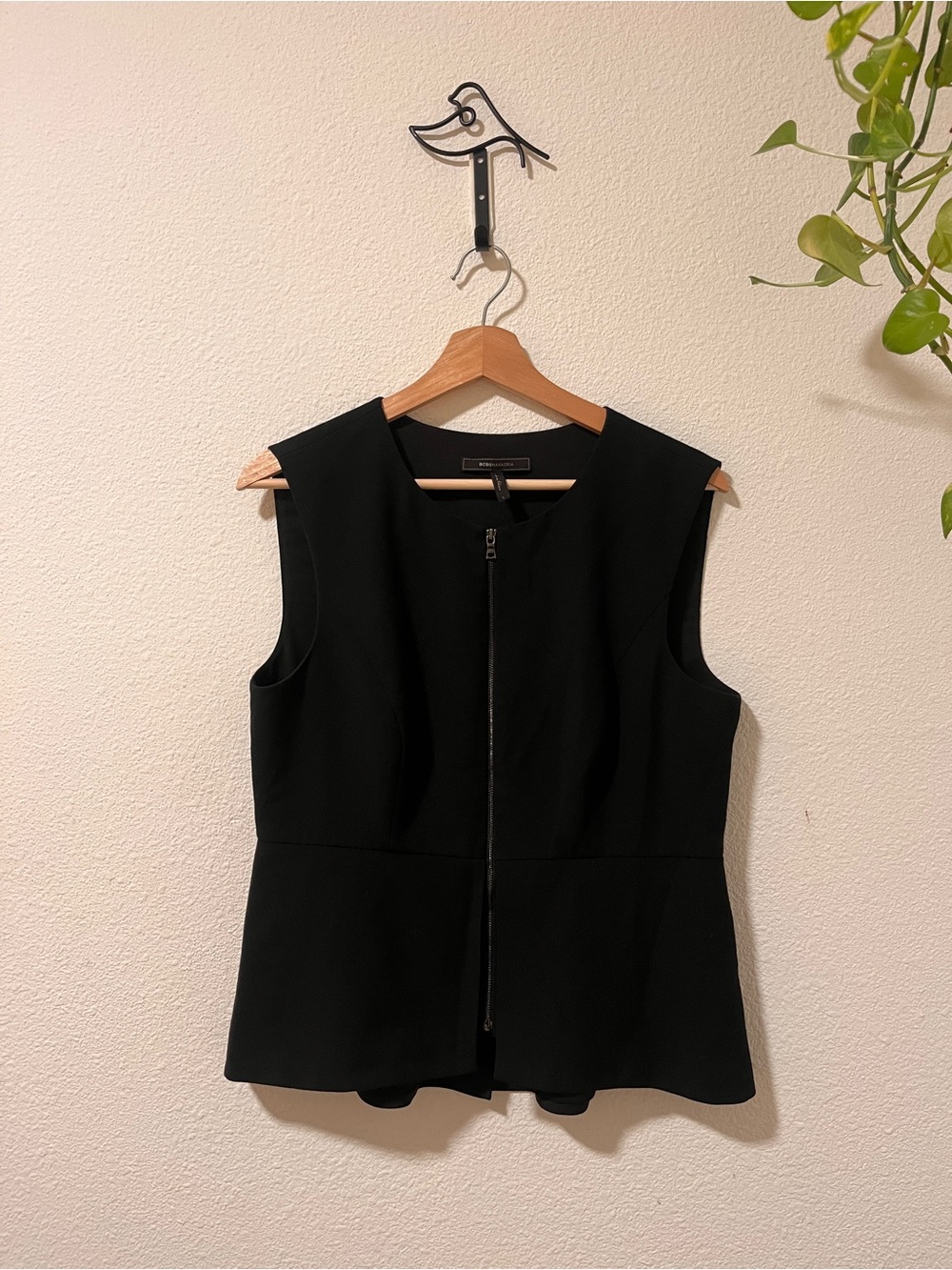 Black Sleeveless Zip-Front Peplum Top